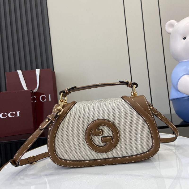 G*u*i top handle bags
